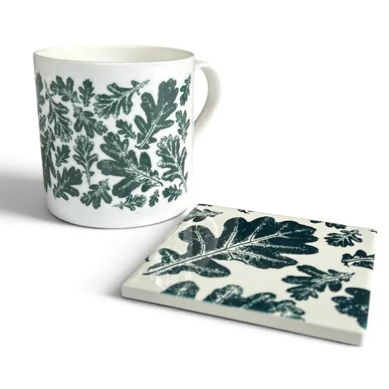 Pembrokeshire Creations & Beyond ceramic mug and coaster set featuring a dark green botanical oak leaf print.